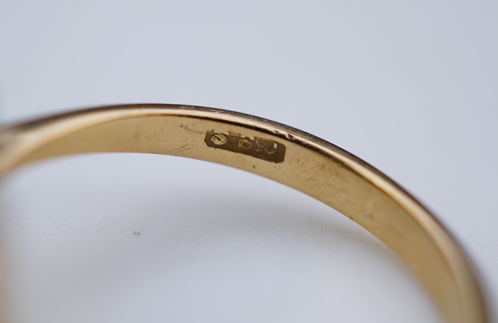 An emerald and diamond ring